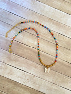 “Seed” bead necklace with charm